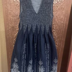 Stretchy tank top dress with white floral detail on skirt. Light and breezy